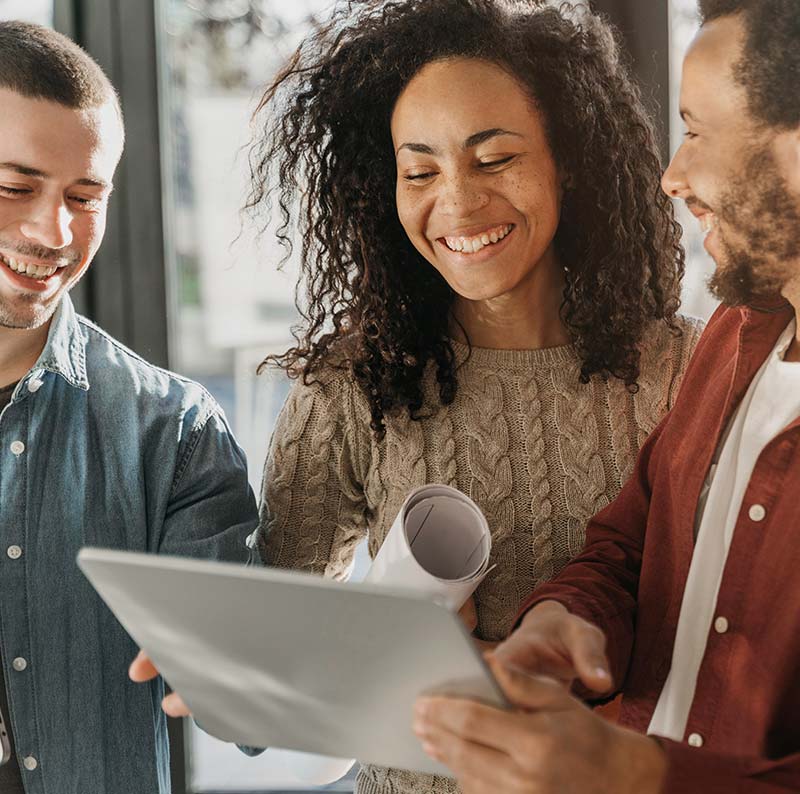 Online accountants for limited companies, three people smiling looking at papers