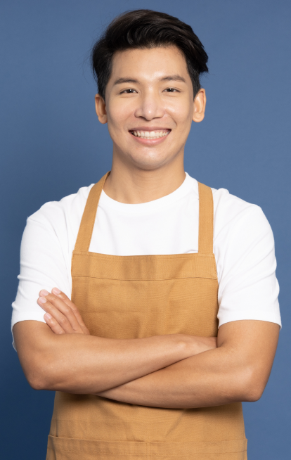 man smiling in apron